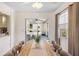 Bright dining area with modern furnishings, a view of the screened-in porch, and neutral decor at 4731 Egret Rd, Venice, FL 34293