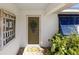 Charming front entryway with security door, wreath, and decorative sidelight at 4731 Egret Rd, Venice, FL 34293