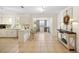 Open kitchen view with bar seating, white cabinetry, and modern appliances at 4731 Egret Rd, Venice, FL 34293