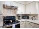 Well-equipped kitchen showcasing stainless steel appliances and modern countertops at 4731 Egret Rd, Venice, FL 34293