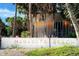 Welcome to Manasota Beach community sign surrounded by tropical trees and lush greenery at 4731 Egret Rd, Venice, FL 34293