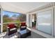 Relaxing covered patio with comfortable seating and sliding glass doors to the indoors at 4731 Egret Rd, Venice, FL 34293