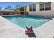 Sparkling backyard pool with a clean, tiled edge and steps, perfect for relaxing and enjoying the outdoors at 4731 Egret Rd, Venice, FL 34293