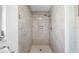Clean shower with marble tiling and shower head at 4731 Egret Rd, Venice, FL 34293
