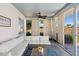 Comfortable sunroom with stylish furniture and access to the outdoors at 4731 Egret Rd, Venice, FL 34293