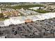 Aerial view showcasing commercial area with busy parking lot and shopping center surrounded by residences at 4945 Getner St, New Port Richey, FL 34652