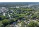 An aerial view highlighting the property's location within a lush, green neighborhood at 512 Winding Willow Dr, Palm Harbor, FL 34683