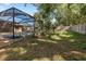 The spacious backyard features mature landscaping, providing a private outdoor area at 512 Winding Willow Dr, Palm Harbor, FL 34683
