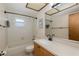 Bathroom featuring a vanity, mirror, and bath tub with shower at 512 Winding Willow Dr, Palm Harbor, FL 34683