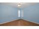 Bedroom features bright-blue painted walls and linoleum flooring at 512 Winding Willow Dr, Palm Harbor, FL 34683