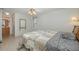 Bedroom featuring a tile floor and an adjacent bathroom at 512 Winding Willow Dr, Palm Harbor, FL 34683