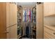Walk-in closet with organized shelving and ample hanging space at 512 Winding Willow Dr, Palm Harbor, FL 34683