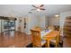 Comfortable dining area next to an open living room and backyard access at 512 Winding Willow Dr, Palm Harbor, FL 34683