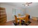 Dining room with an oval table, four chairs, and a ceiling fan at 512 Winding Willow Dr, Palm Harbor, FL 34683
