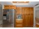 Kitchen features a stainless steel refrigerator and lots of cabinet space at 512 Winding Willow Dr, Palm Harbor, FL 34683