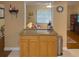 Open kitchen with granite counter tops and view of living room at 5406 Dartmouth Rd, New Port Richey, FL 34652