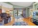 Open living room with a view of the lanai and pool, seamlessly blending indoor and outdoor spaces at 5411 Wellfield Rd, New Port Richey, FL 34655