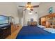 Spacious bedroom with vaulted ceiling and a large ceiling fan at 5411 Wellfield Rd, New Port Richey, FL 34655