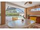 Outdoor dining area under a screened enclosure overlooking the pool at 5411 Wellfield Rd, New Port Richey, FL 34655