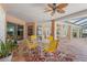 Covered patio area with ceiling fan, ideal for relaxing or dining al fresco at 5411 Wellfield Rd, New Port Richey, FL 34655