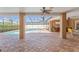 Large, screened-in lanai featuring tiled floors, ceiling fans, and access to a private pool at 5411 Wellfield Rd, New Port Richey, FL 34655