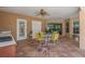 Spacious covered patio featuring an outdoor dining area and a partial outdoor kitchen area perfect for entertaining at 5411 Wellfield Rd, New Port Richey, FL 34655