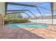 Enclosed swimming pool offers privacy and relaxation with a well-maintained deck area, great for outdoor enjoyment at 5411 Wellfield Rd, New Port Richey, FL 34655
