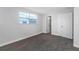 Bright bedroom featuring fresh paint, plush carpet, and a spacious closet at 5651 Townhouse Dr # 5651, New Port Richey, FL 34652