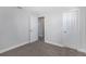 This room has a neutral color palette, gray carpet, and trim for a clean and relaxing feel at 5651 Townhouse Dr # 5651, New Port Richey, FL 34652