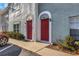 Charming townhome entrance with brick facade, arched doorways, and well-maintained landscaping at 5651 Townhouse Dr # 5651, New Port Richey, FL 34652