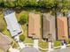 Aerial view of homes showing the roofs, driveways, and lawns at 5676 Legend Hills Ln, Spring Hill, FL 34609
