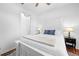 Bright bedroom featuring a white wood frame bed, ceiling fan, and closet at 5676 Legend Hills Ln, Spring Hill, FL 34609