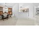 Open concept dining and kitchen area with ample natural light at 5676 Legend Hills Ln, Spring Hill, FL 34609