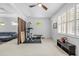 Bright white exercise area, including an exercise bike, weight rack, and bench at 5676 Legend Hills Ln, Spring Hill, FL 34609