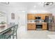 Updated kitchen with stainless appliances and breakfast area beyond at 5676 Legend Hills Ln, Spring Hill, FL 34609