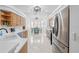 Bright kitchen with stainless steel appliances, light cabinets and breakfast nook at 5676 Legend Hills Ln, Spring Hill, FL 34609