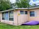 Back corner view, showcasing large windows and a clean design at 6045 Colony Cir, Weeki Wachee, FL 34607