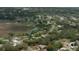 Enjoy this serene property from above, with a picturesque lake view and lush greenery surrounding the area at 6516 Hillview Rd, Spring Hill, FL 34606