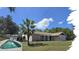 Charming single-story home with in-ground pool, brick accents, attached garage and well-maintained lawn at 6516 Hillview Rd, Spring Hill, FL 34606