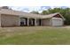 Charming single-story home with brick facade, well-kept lawn, and an attached single-car garage at 6516 Hillview Rd, Spring Hill, FL 34606