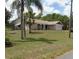 Charming single-story home featuring a well-maintained lawn, brick accents, and an attached garage at 6516 Hillview Rd, Spring Hill, FL 34606