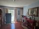 Comfortable room featuring a sliding glass door to pool area, and wooden accents at 6516 Hillview Rd, Spring Hill, FL 34606