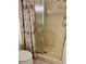 Bathroom highlighting shower with curtain and updated toilet at 6527 Spring Flower Dr # 24, New Port Richey, FL 34653