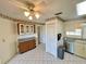 Functional kitchen with tiled floor, ample counter space, and classic cabinetry at 6527 Spring Flower Dr # 24, New Port Richey, FL 34653