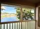 Scenic lake view framed by lush trees, seen from the enclosed, screened-in patio at 6527 Spring Flower Dr # 24, New Port Richey, FL 34653