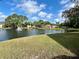 Pond with a fountain and lush landscaping at 6527 Spring Flower Dr # 24, New Port Richey, FL 34653