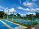 Outdoor shuffleboard courts surrounded by lush greenery, offering a recreational activity for residents at 6527 Spring Flower Dr # 24, New Port Richey, FL 34653
