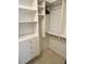 Organized walk-in closet with shelves, drawers, and rods for versatile storage options at 6527 Spring Flower Dr # 24, New Port Richey, FL 34653