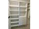 Custom walk-in closet offering ample shelving and drawer space for organized storage solutions at 6527 Spring Flower Dr # 24, New Port Richey, FL 34653