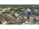Aerial view of a residential property with waterfront access, a private dock, and a sparkling pool at 6552 River Rd, New Port Richey, FL 34652